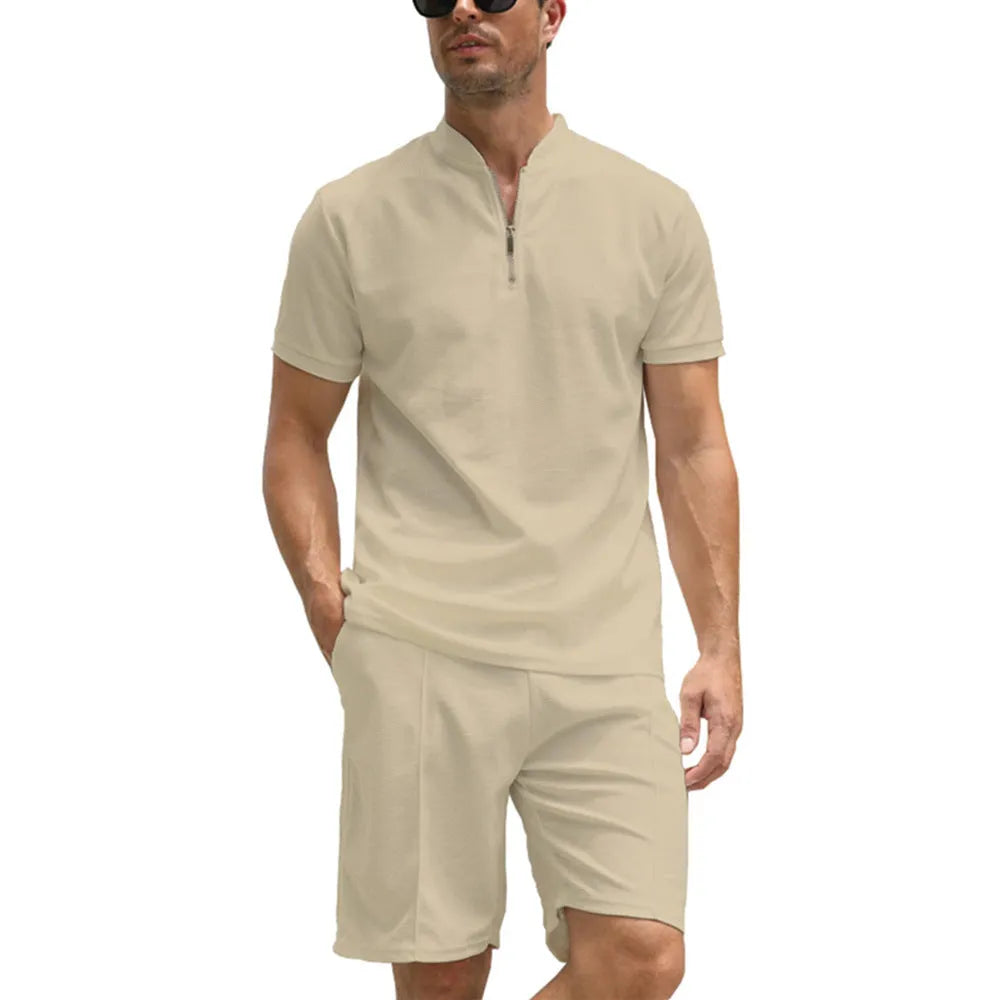 Men's solid colour polo shirt and matching trousers two-piece suit set on a hanger.