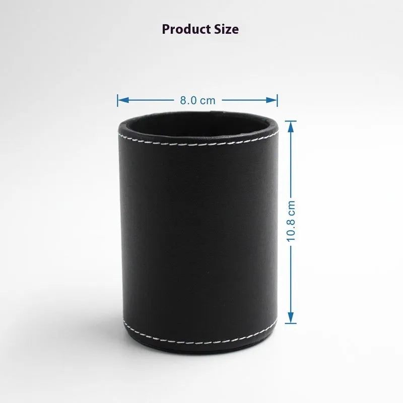 Black leather round pen holder on a desk