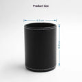 Black leather round pen holder on a desk