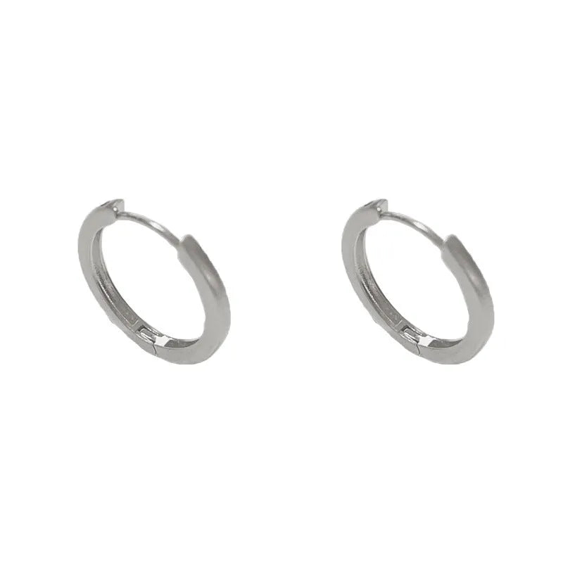 Women's geometric ear clip jewellery with round elements in gold plating on copper