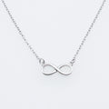 925 silver through-the-body pendant necklace with adjustable chain in platinum finish on collarbone