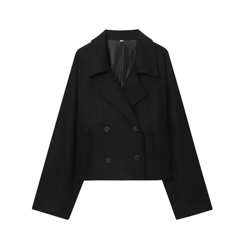 Short double breasted woolen coat in black with front pockets on a woman for commute wear