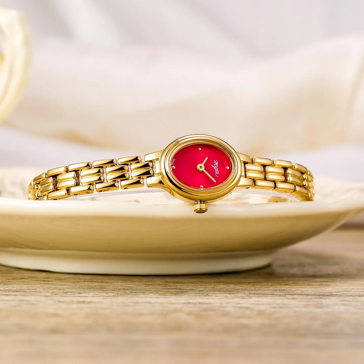 Oval mini women's vintage quartz watch with gold alloy case, white dial, and jewellery buckle