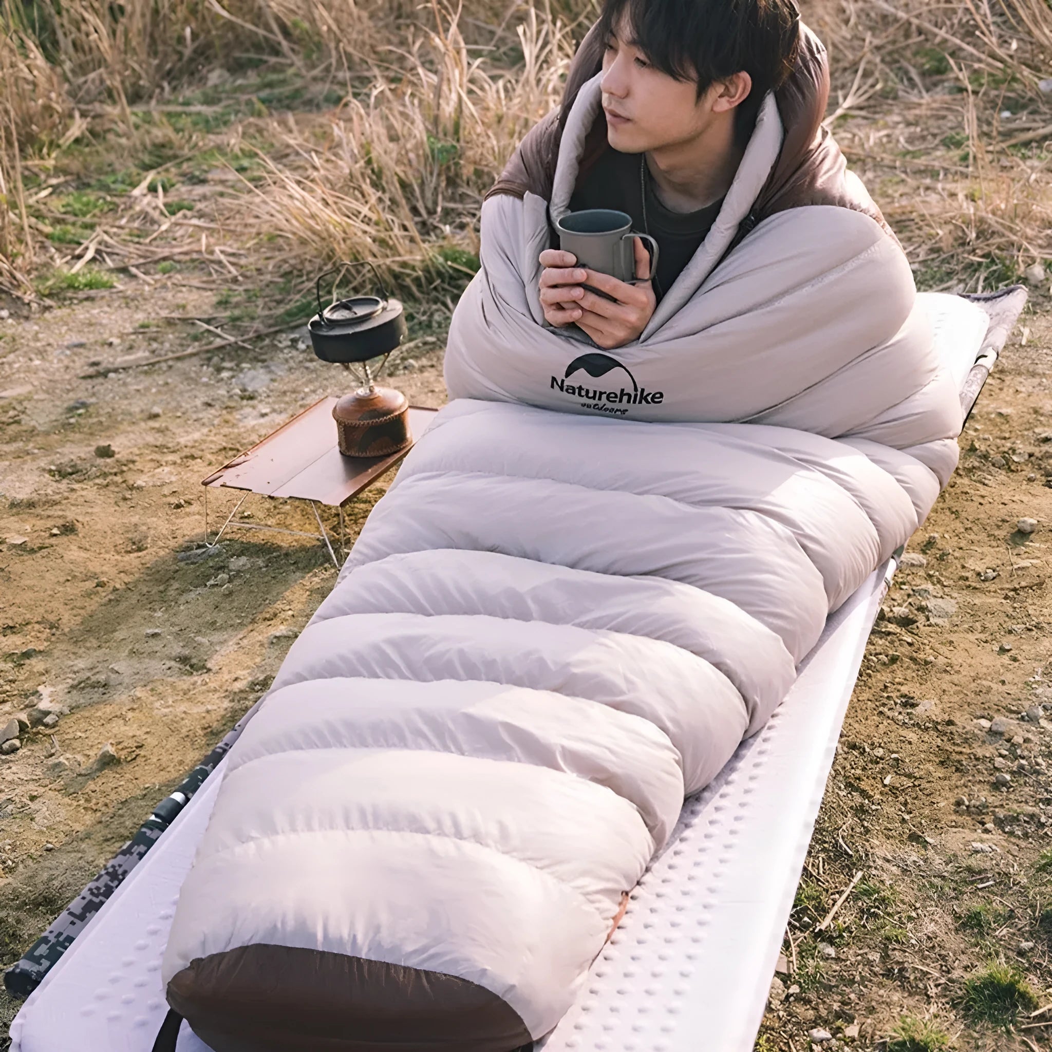 Goose down mummy sleeping bag for adults with storage bag, shown in multiple size and weight options.