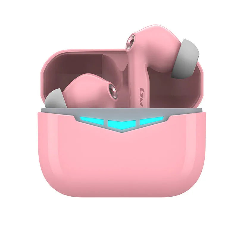 Black true wireless gaming earbuds and charging case with three pairs of silicone earmuffs on a grey background.