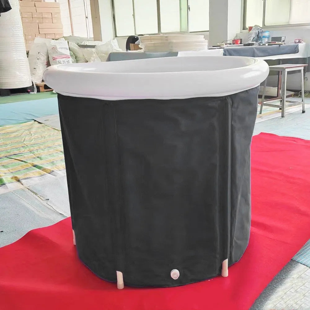 Black inflatable PVC portable ice bath tub with insulation and a fitted weather lid.