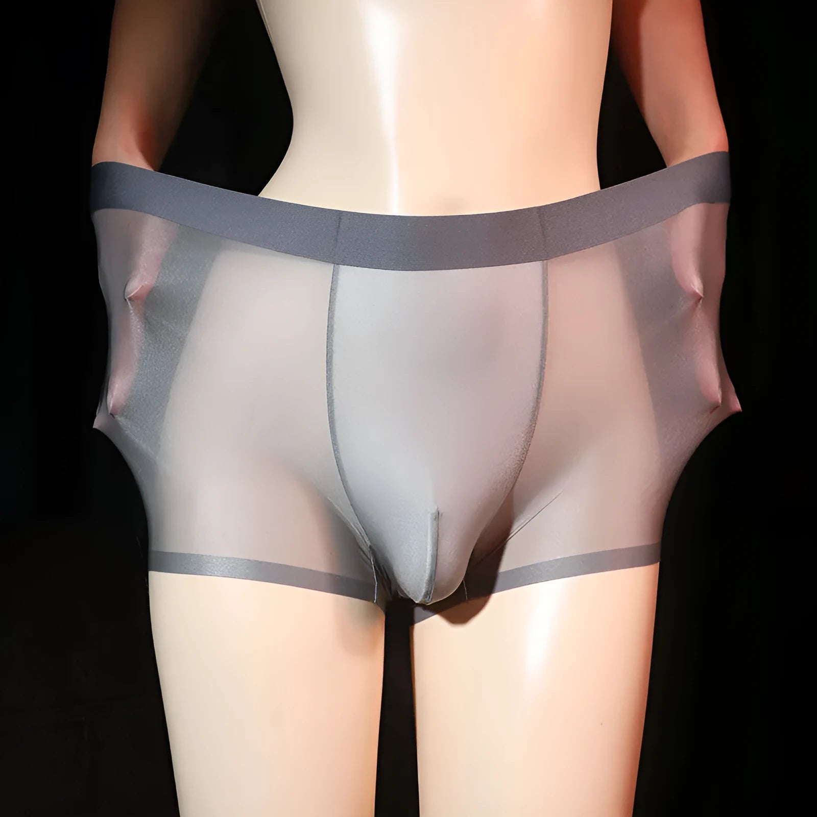 Men's light grey ice silk boxer underwear laid flat, showing ultra-thin nylon fabric.