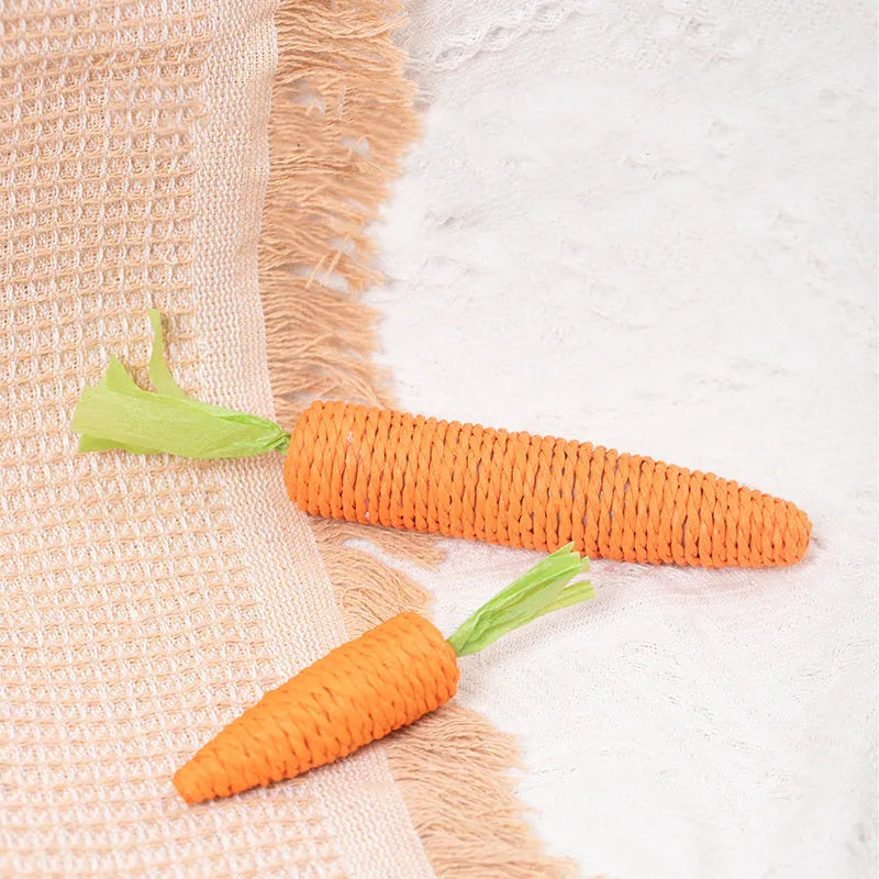 Set of four different cat toys including paper crinkle toys, ringing stones, textured sticks, and tooth grinding sticks