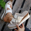 White patent leather women's wedge sandals with peep toe and woven detail on a rubber sole.