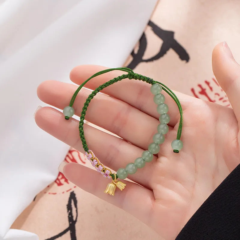 Hand woven red rope women's bracelet with Lily design and floral national style decoration