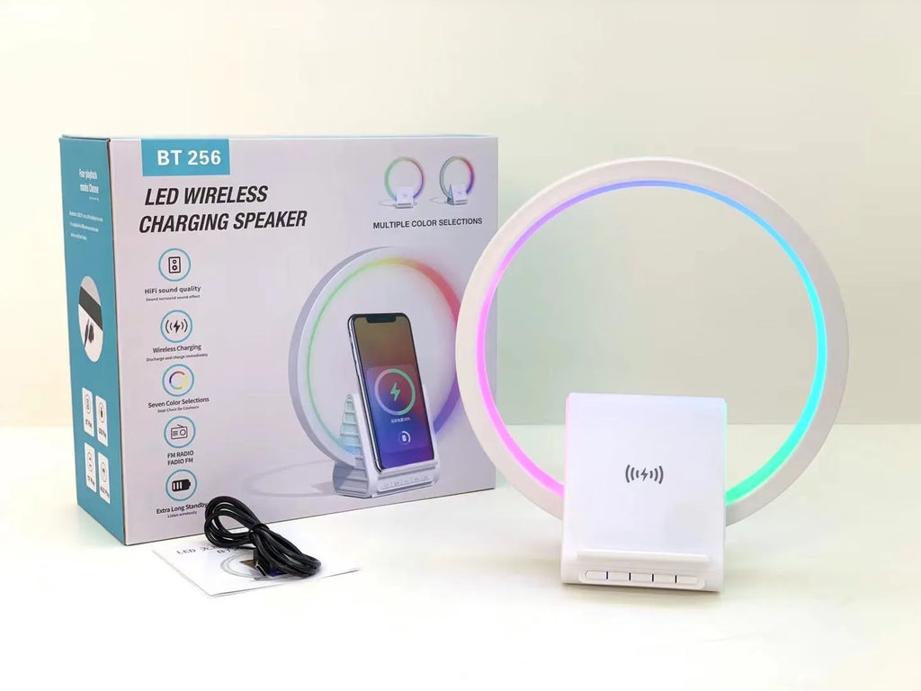 White smart Bluetooth speaker with wireless charging pad and ambient light ring