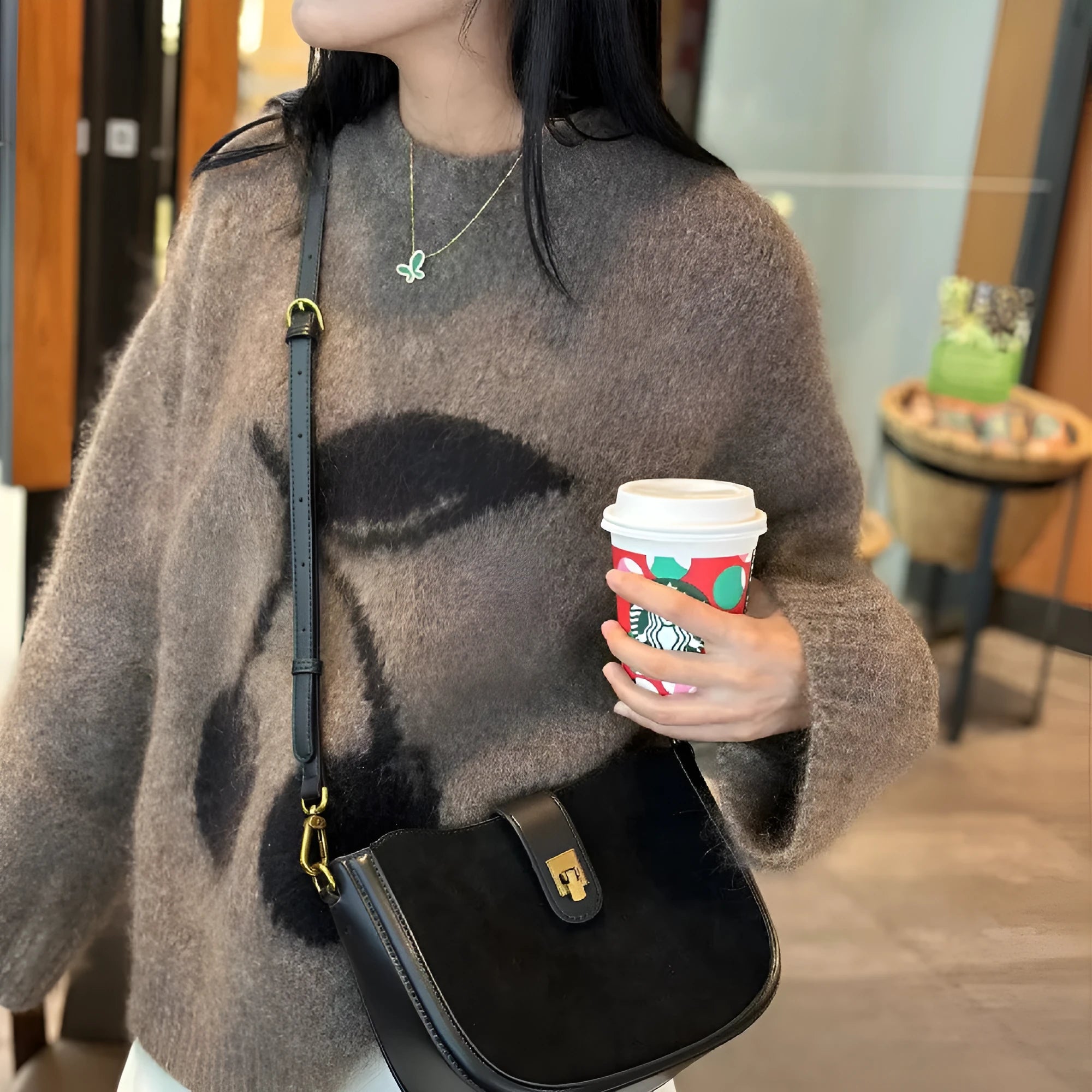 Women's black genuine leather crossbody bag with one-shoulder design and sandwich pocket exterior