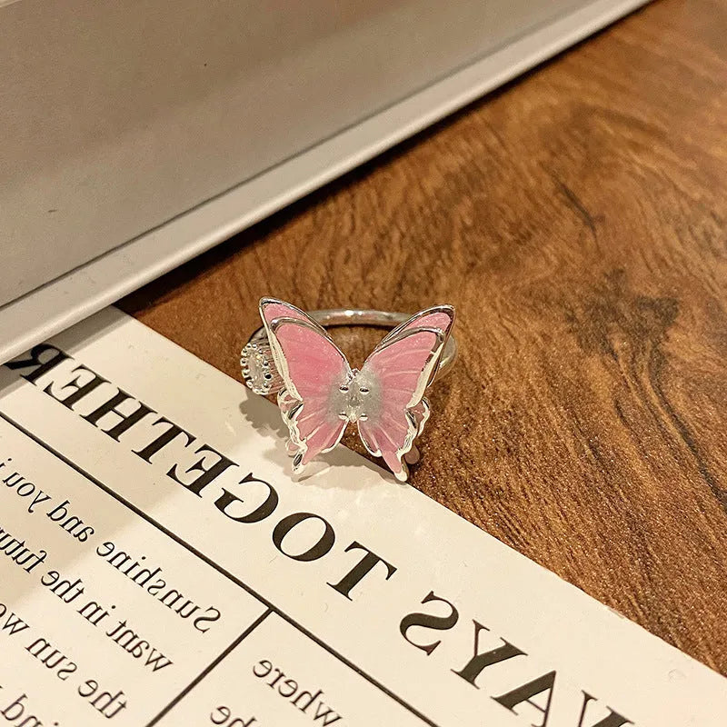 Simple copper women's ring with a Chinese butterfly design, showing an example from the 33 available numbered styles.