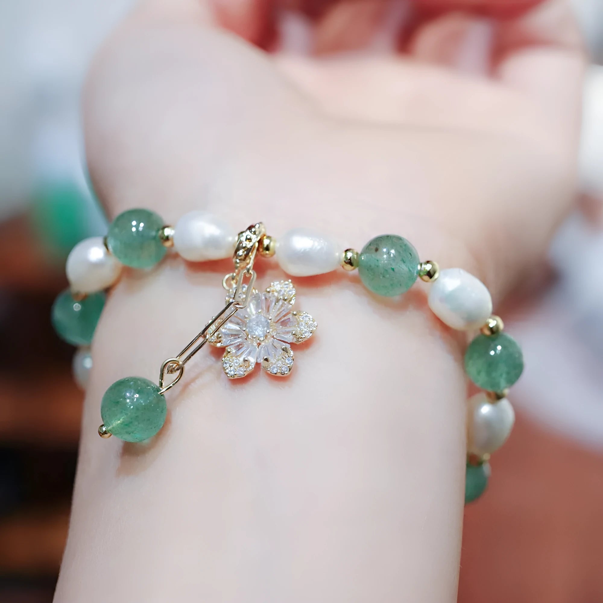 Green strawberry freshwater pearl bracelet with Chinese knot and peace buckle design