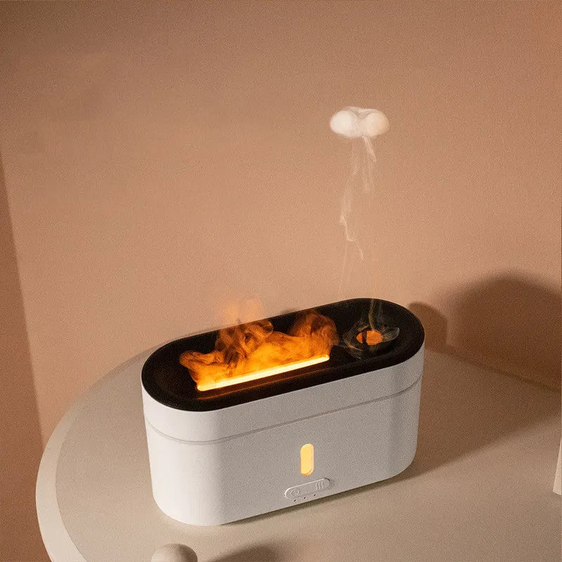 White resin flame lamp humidifier with two fog outlets and visible flame effect on a wooden table
