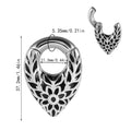 Drop-shaped teardrop earlobe stretcher in stainless steel with a coloured finish and totem detailing.