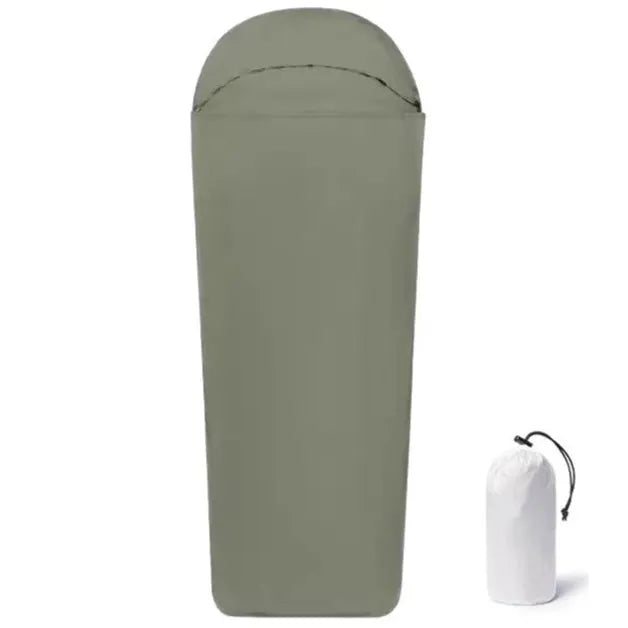 Blue lightweight mummy-style nylon sleeping bag with tapered foot, shown rolled up for travel.