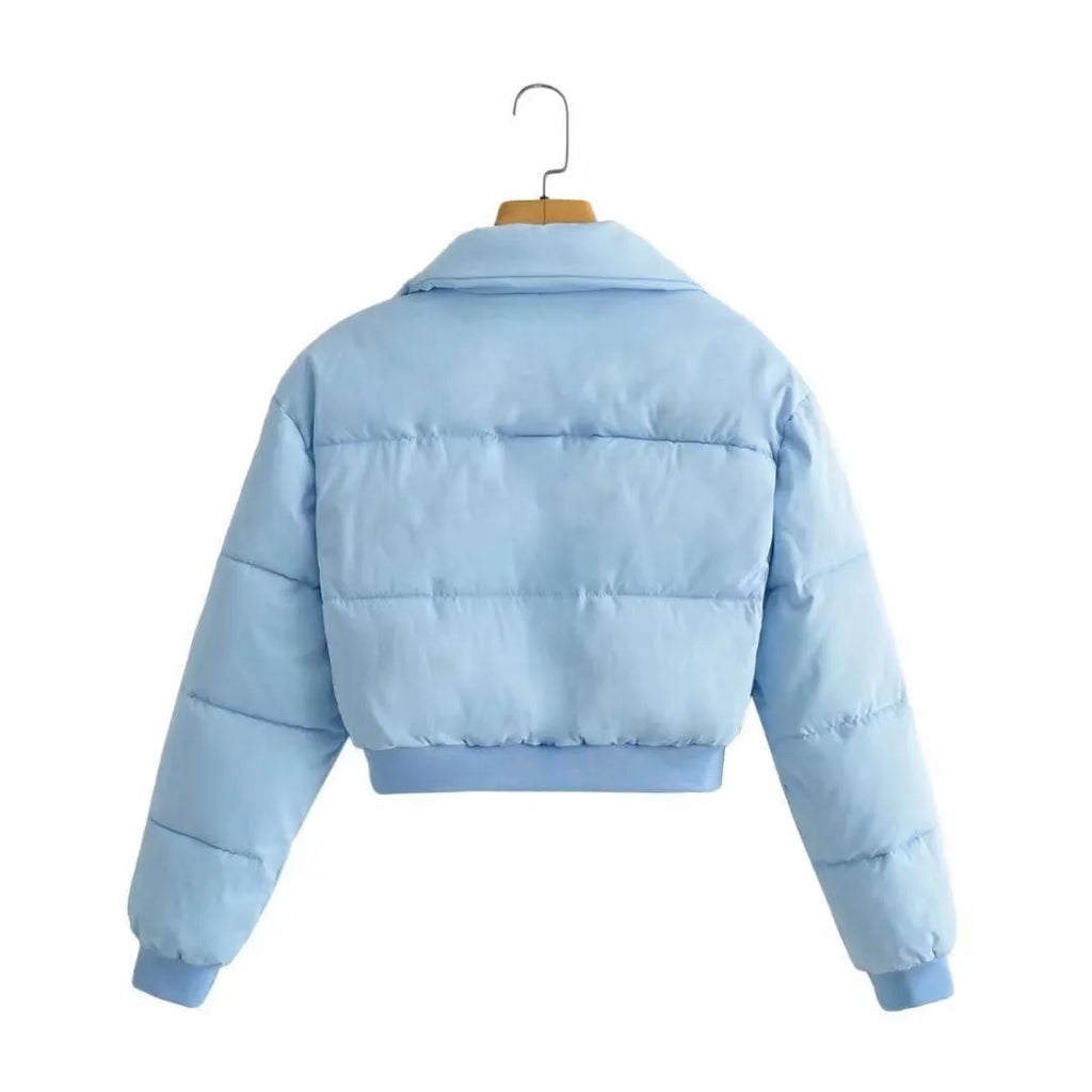 A woman's loose-fitting long sleeve polyester jacket in a casual style, shown in a blue colour variant.