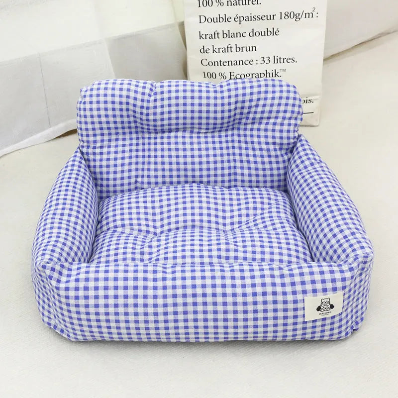 Grey and blue plaid car-mounted cloth nest for dogs, shown in small and large size options.