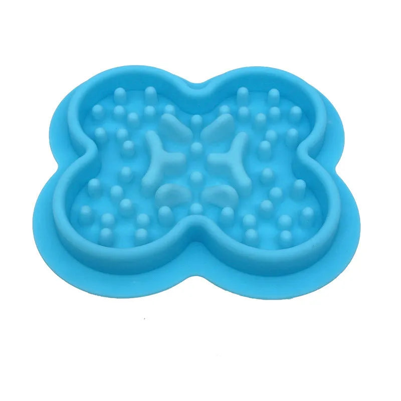 Silicone slow feed licking pad for cats and dogs on a floor, showing textured surface and raised edge.
