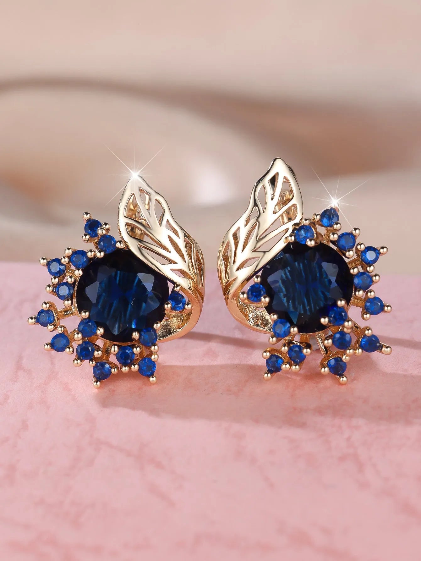 Round flower feather zircon earrings with champagne gold finish and coloured stone centre