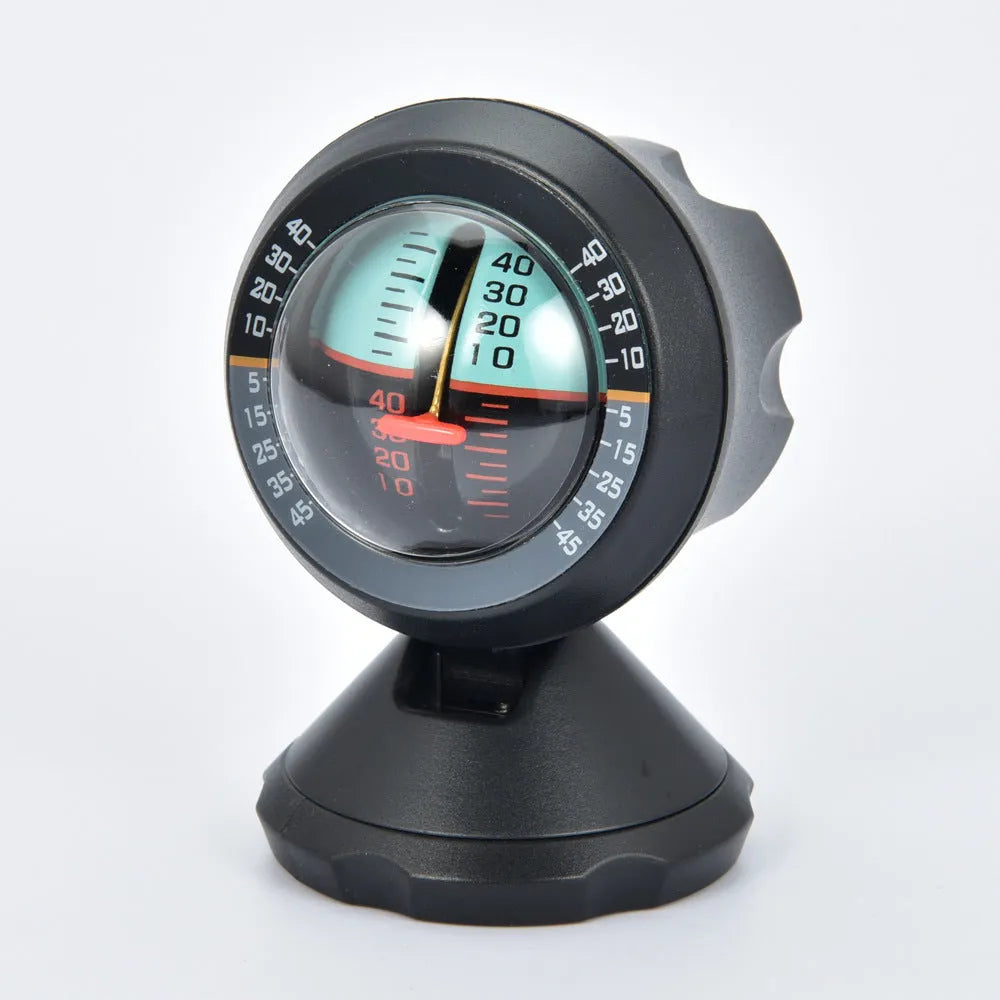 Black vehicle mounted slope meter for measuring car inclination and elevation angles on dashboard.