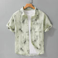 Linen blend printed short sleeve shirt cardigan in light green floral pattern, loose fit, on a female model