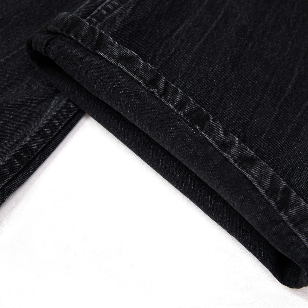 Black mens straight-leg jeans with American washed lightning crack detailing on cotton fabric