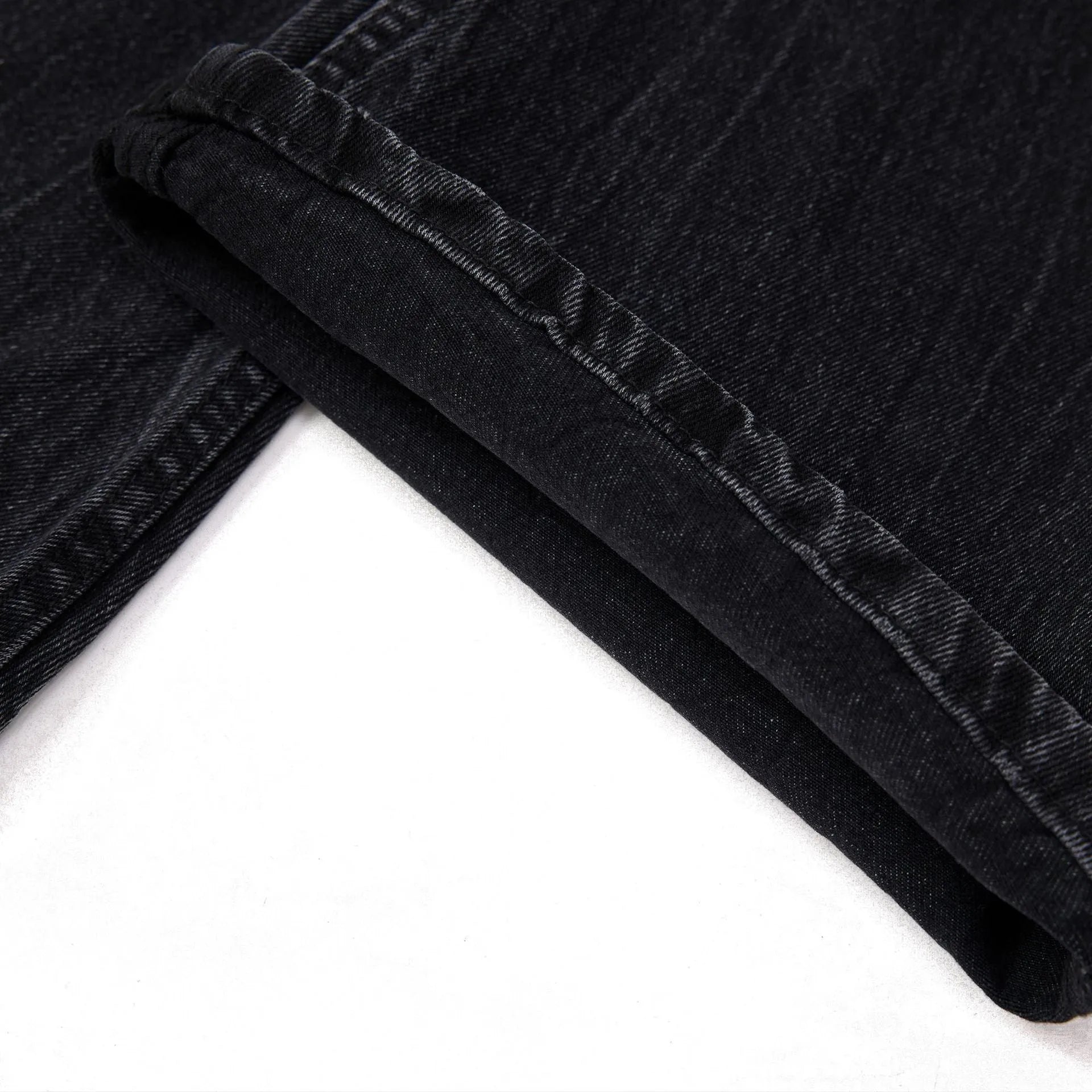 Black mens straight-leg jeans with American washed lightning crack detailing on cotton fabric