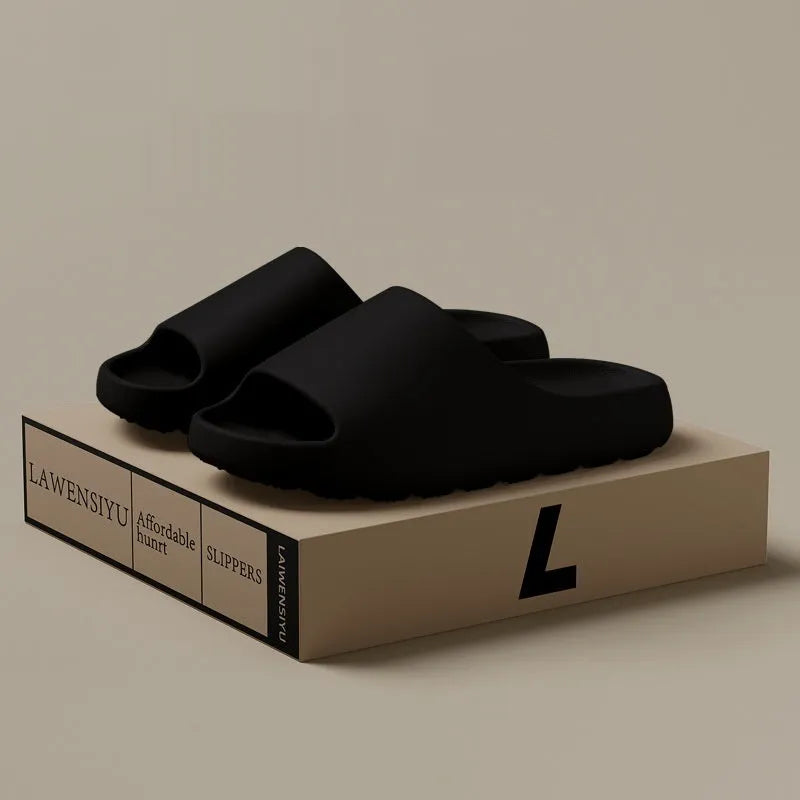 Women's thick-soled EVA beach slippers in beige, shown on a sandy background.