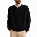 A grey men's textured knit half-zip sweater with a loose fit and long sleeves on a mannequin.