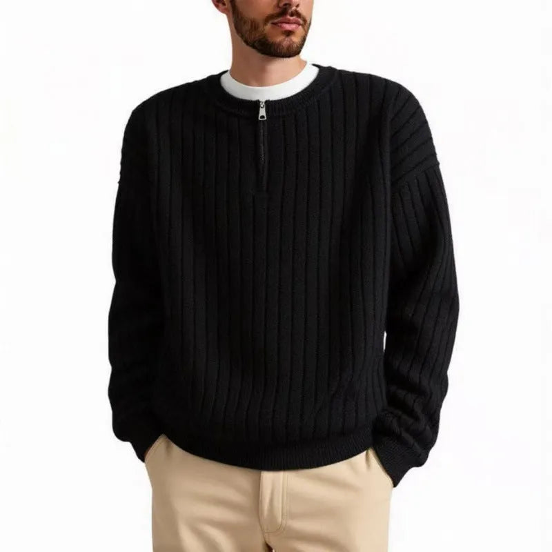 A grey men's textured knit half-zip sweater with a loose fit and long sleeves on a mannequin.
