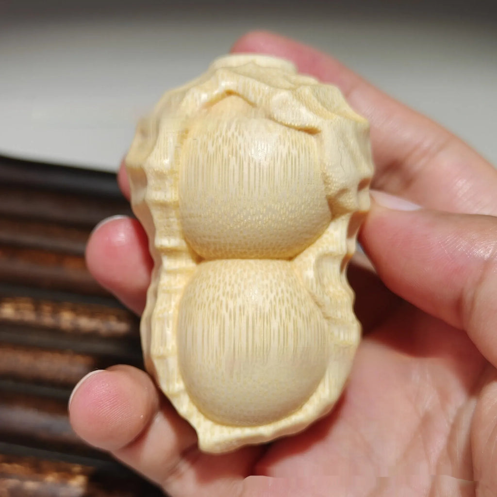 Natural solid bamboo peanut carving ornament with 'May Good Things Happen' inscription