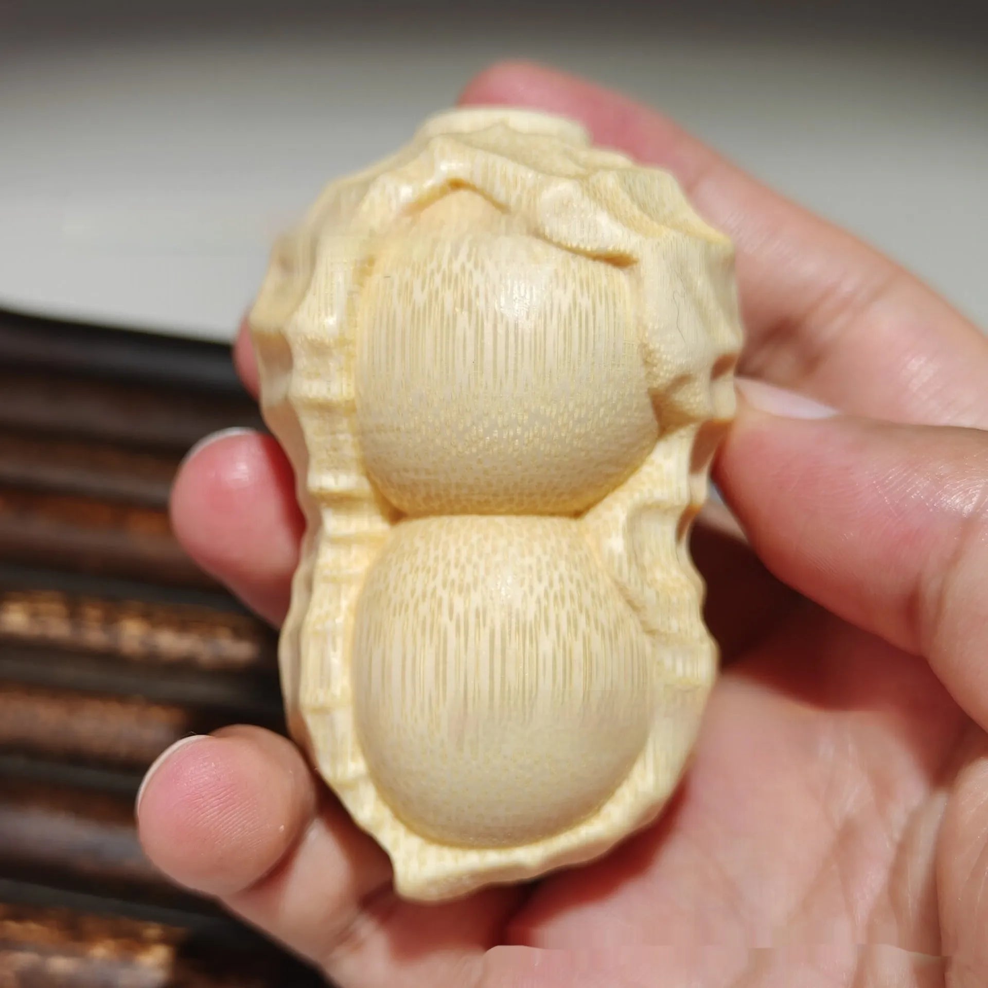 Natural solid bamboo peanut carving ornament with 'May Good Things Happen' inscription