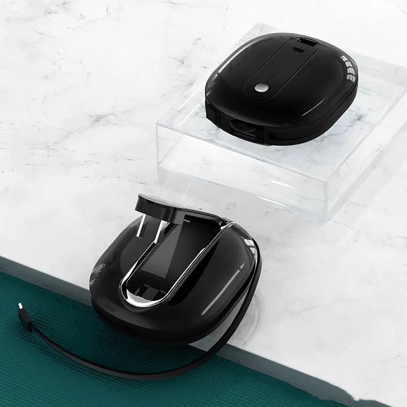White and black two-in-one power bank with built-in wall plug showing 10000mAh capacity