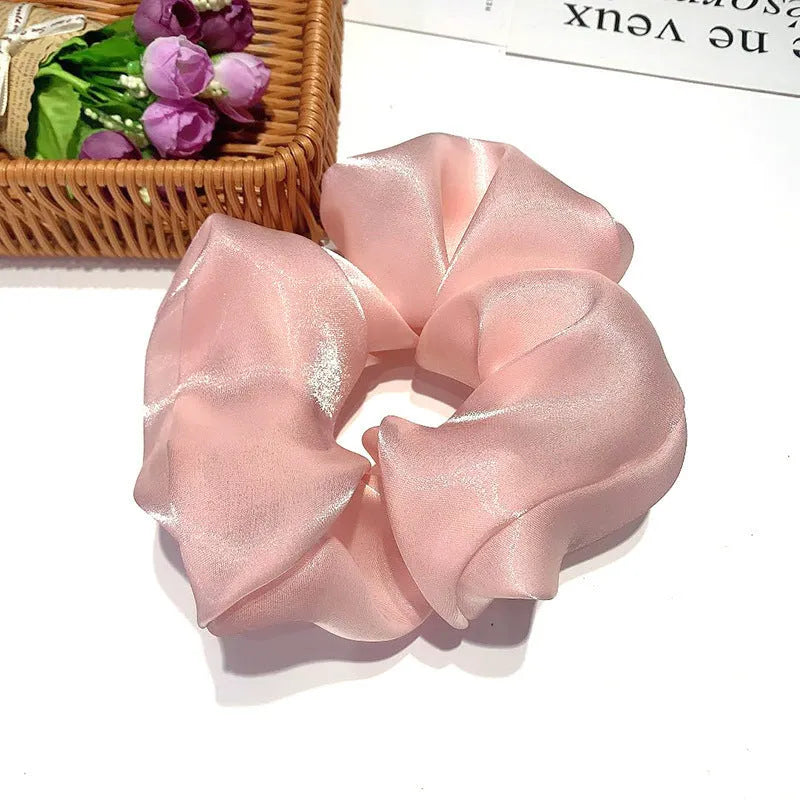 Korean style cloth hair ring with crystal satin finish in light pink colour on a white background