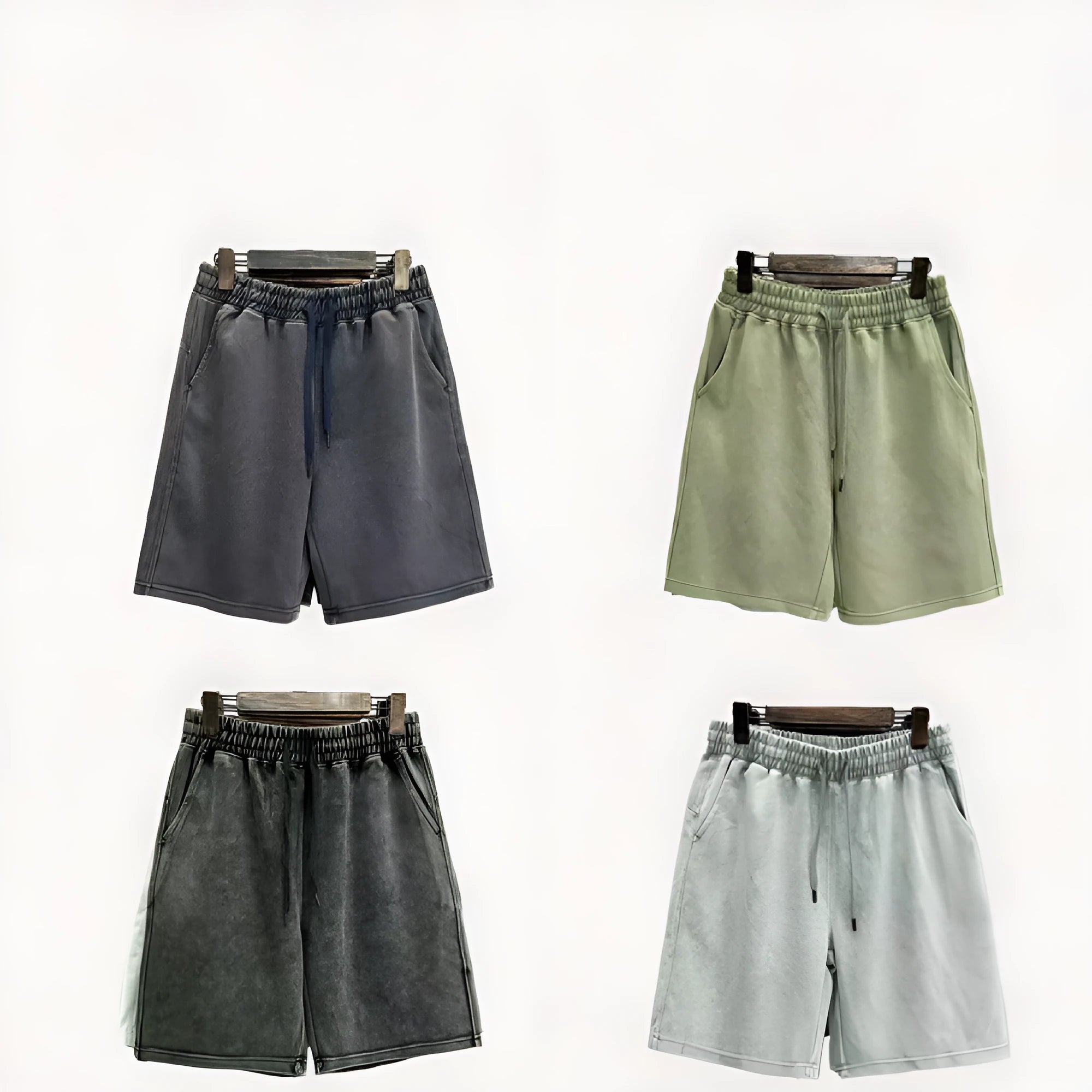 Man wearing solid colour distressed cotton shorts with a loose casual straight-leg fit