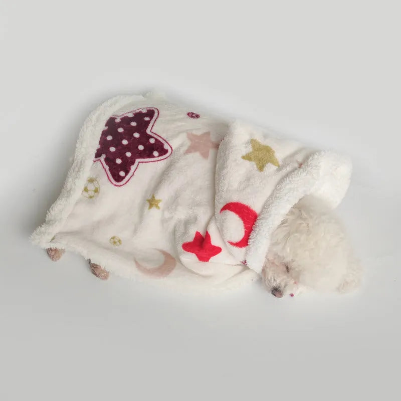 White coral fleece pet pajamas with moon and stars pattern on a light background, size M
