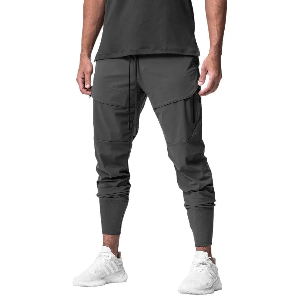 Men's solid colour polyester jogger pants in black, mid-waist micro-elasticity sports trousers for autumn leisure.