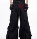 Boy modelling black Korean-style wide-leg summer trousers in a casual setting.