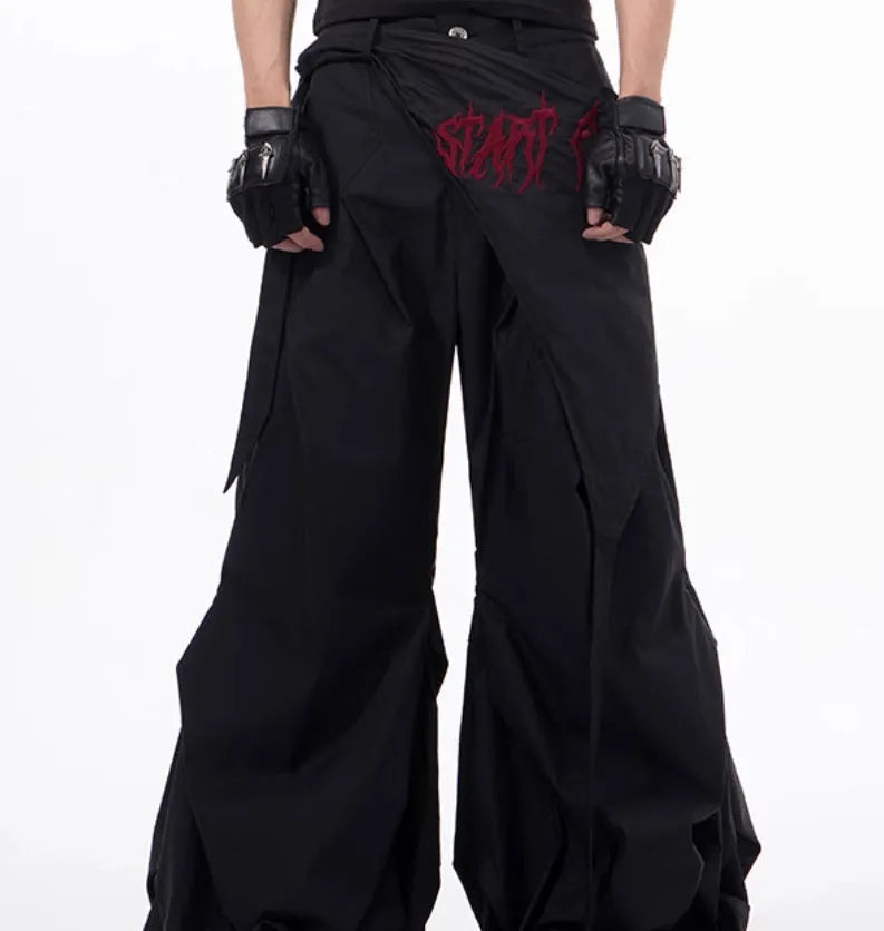Boy modelling black Korean-style wide-leg summer trousers in a casual setting.