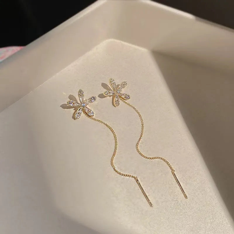Long style gold dangle earrings for women with metal construction