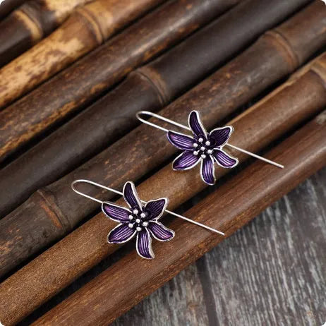 Purple flower-shaped alloy earrings with electroplated finish