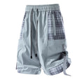 Men's black cargo shorts with plaid stitching pattern, loose fit design, and cargo pockets