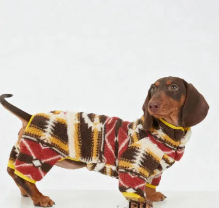 Thick four-legged dog clothing with diamond pattern in red for autumn and winter, side view on a dog