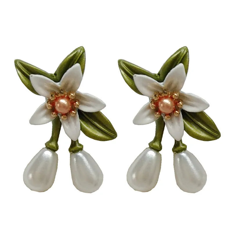 Alloy flower ear stud and clip set with sterling silver needle camellia design and contrasting colour floral motif