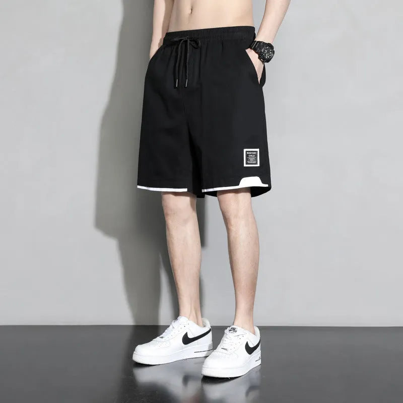 Boy wearing khaki cotton shorts with mid-waist, showing front view.
