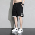 Boy wearing khaki cotton shorts with mid-waist, showing front view.