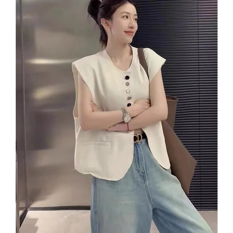 Women's loose-fit polyester vest in solid colour with a pocket, shown in milky white.