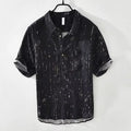 Man wearing a loose-fit black lapel polo shirt, a short-sleeved cardigan-style t-shirt for summer.